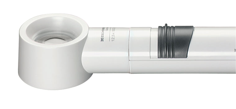 White, circular magnifier attached to battery handle