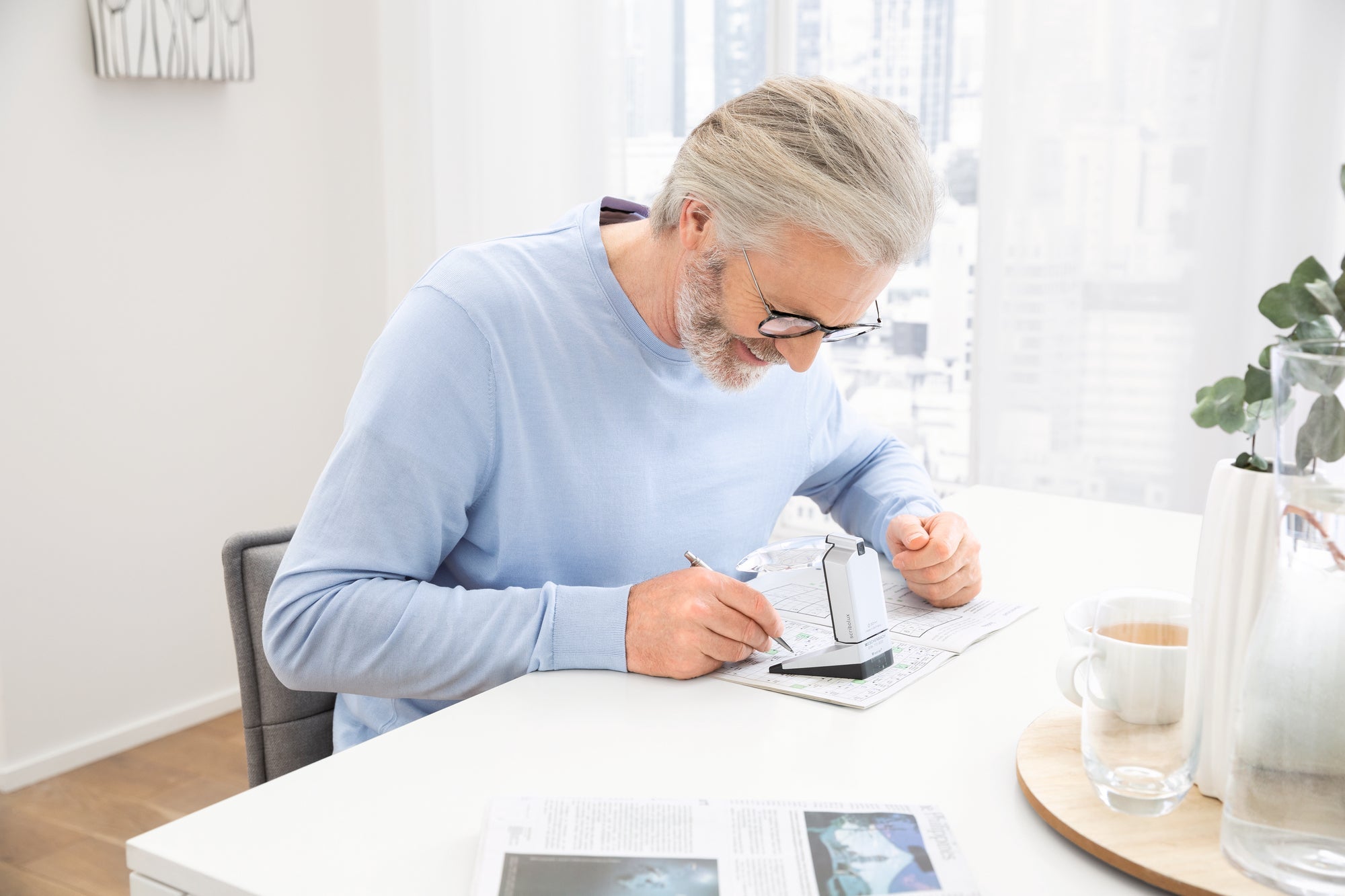 Man writing under Scribolux 