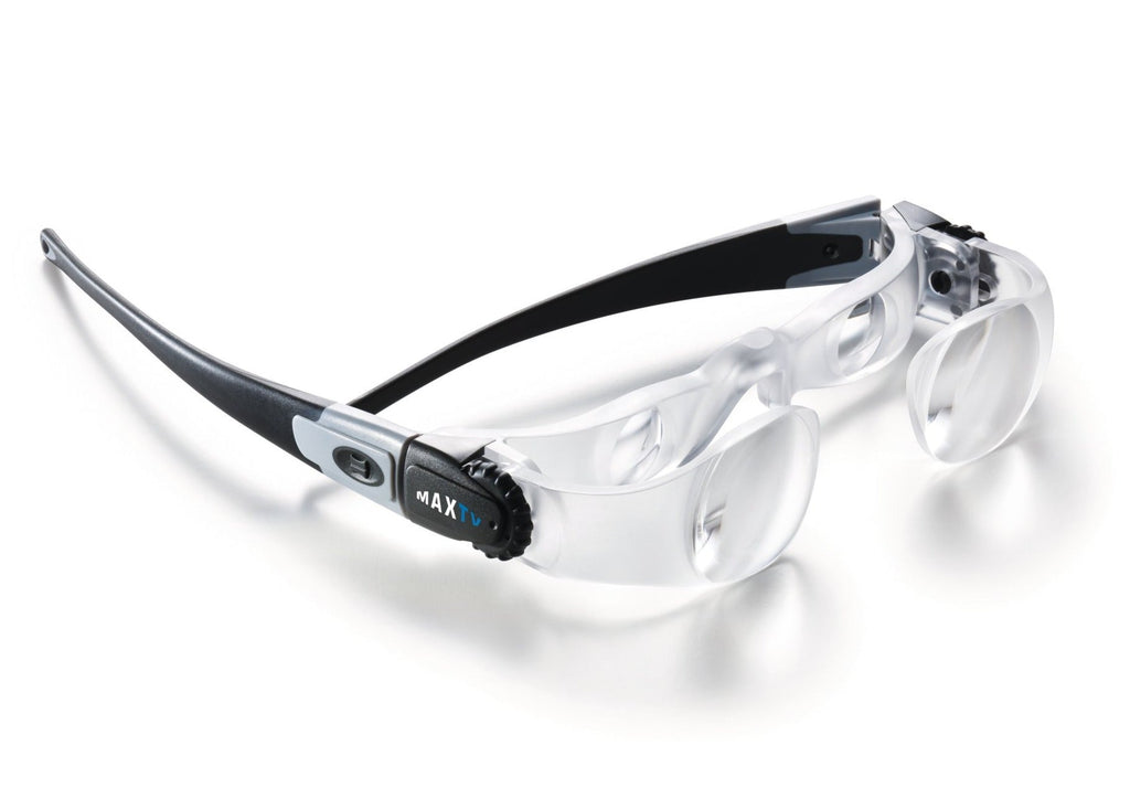 Heavy duty plastic frame with double lens magnifying system. Black frame with black adjusting cogs on temples, and clear lens casing.