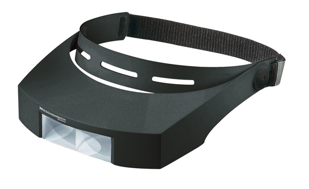 Black headband and visor (sits around top of head, over eyes) with magnifying lens at front of visor.