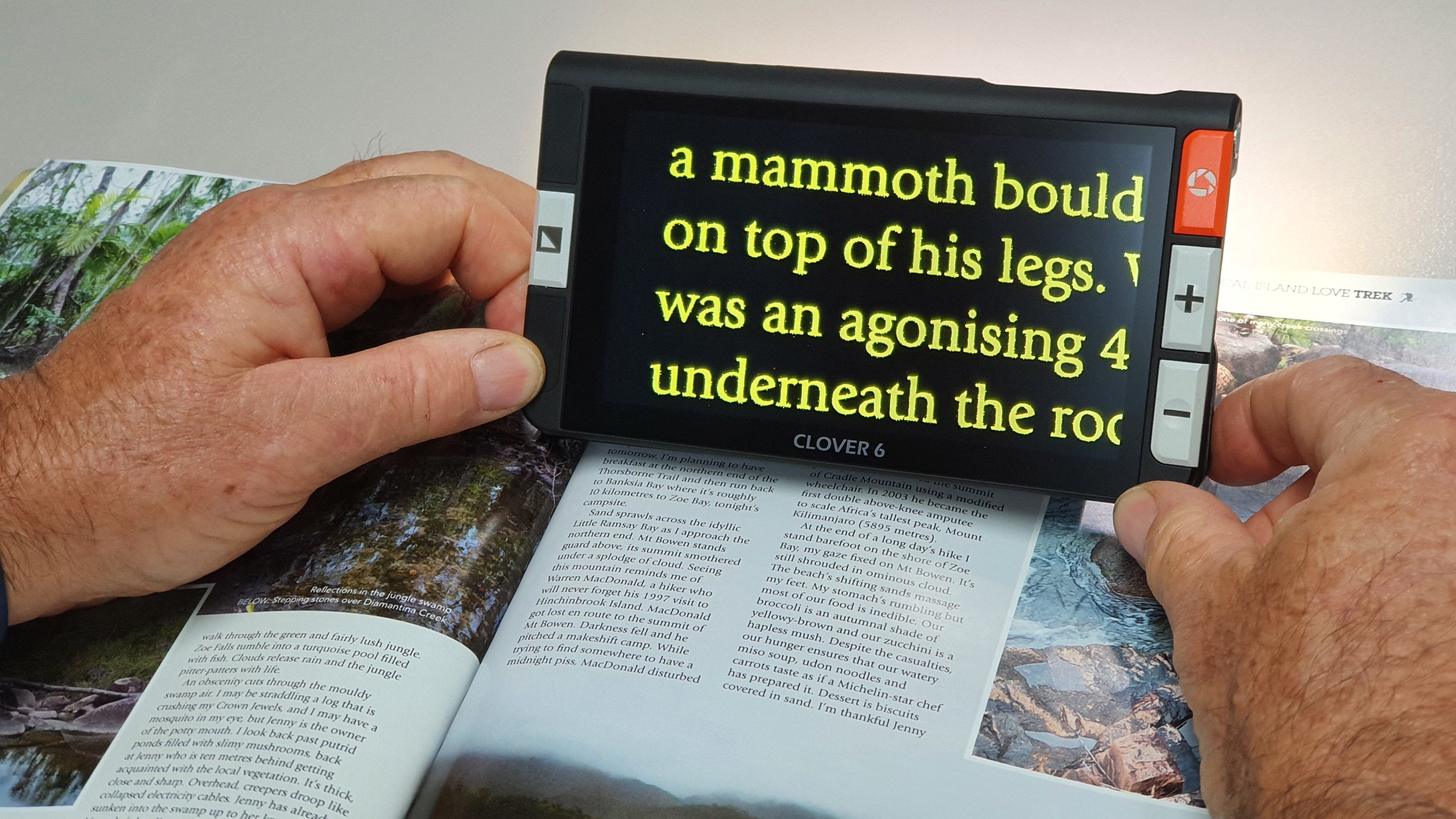 Clover 6 being used to read a book