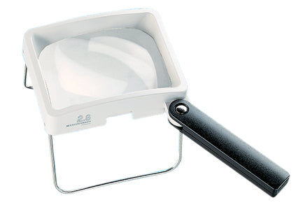 Rectangular magnifier with white housing, black handle and rectangular stand.