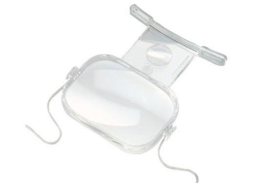 Clear plastic encasing large rectangular magnifying lens with a smaller, higher powered magnifying lens below. Clear feet designed to sit on chest and neck strap are shown.